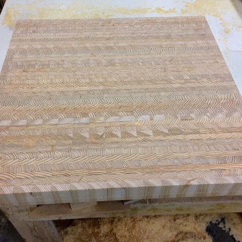 An end grain countertop being manufactured.