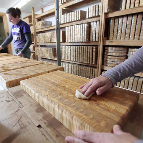 Oiling and conditioning our professional end grain kitchen cutting boards.