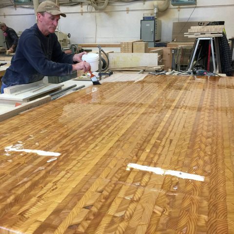 Applying a food safe mineral oil to a Larch Wood end grain countertop.