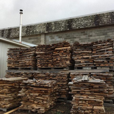 Using cutoff larch wood to heat business.